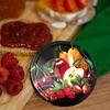 Uzáver fi 82/6 ovocie na čiernom pozadí - 10 ks. - 6 ['uzávery', ' poháre', ' uzávery na džemy', ' skladovanie', ' uzávery na poháre', ' sezónne ovocie', ' viečka na poháre', ' uzáver fi 82', ' uzávery s klikom']